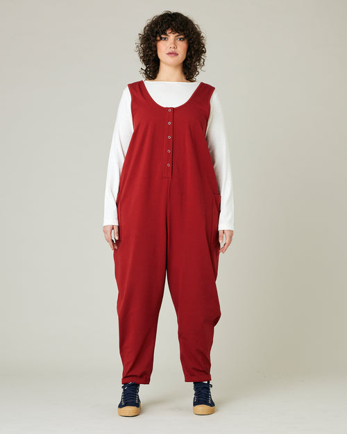 model wears cherry red poppy jumpsuit