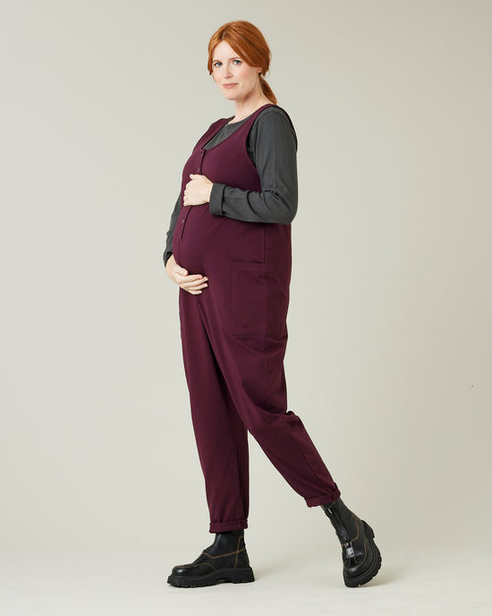 pregnant model wears wine cotton jersey poppy jumpsuit