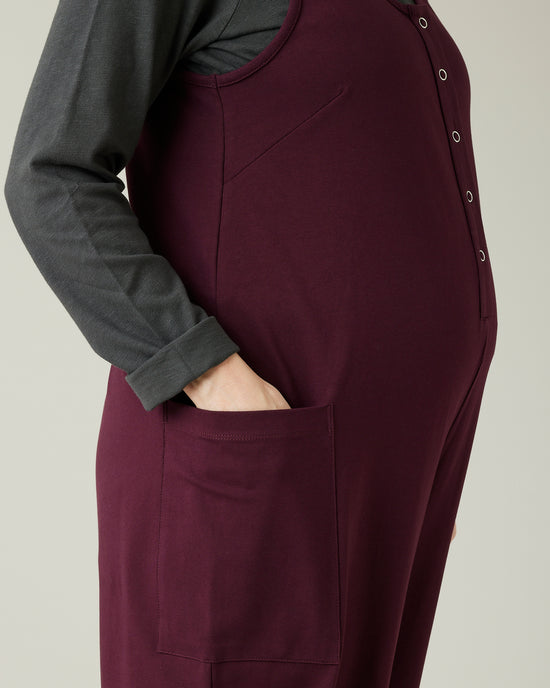 pregnant model wears wine cotton jersey poppy jumpsuit