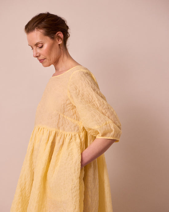 model wears prue butter organza dress