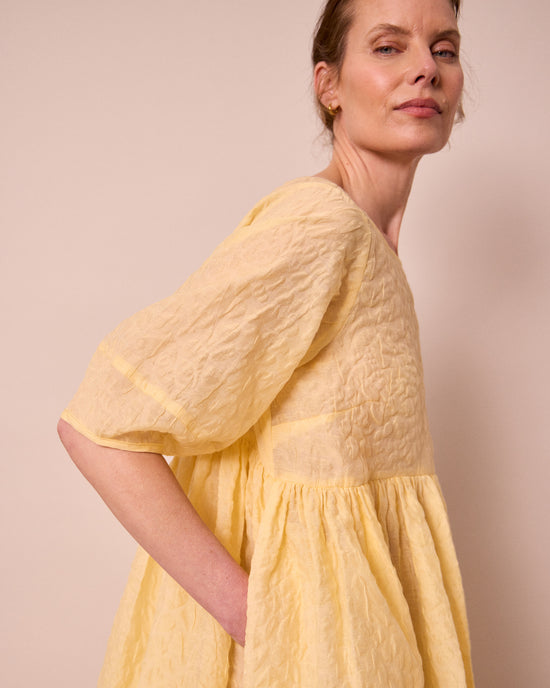 model wears prue butter organza dress