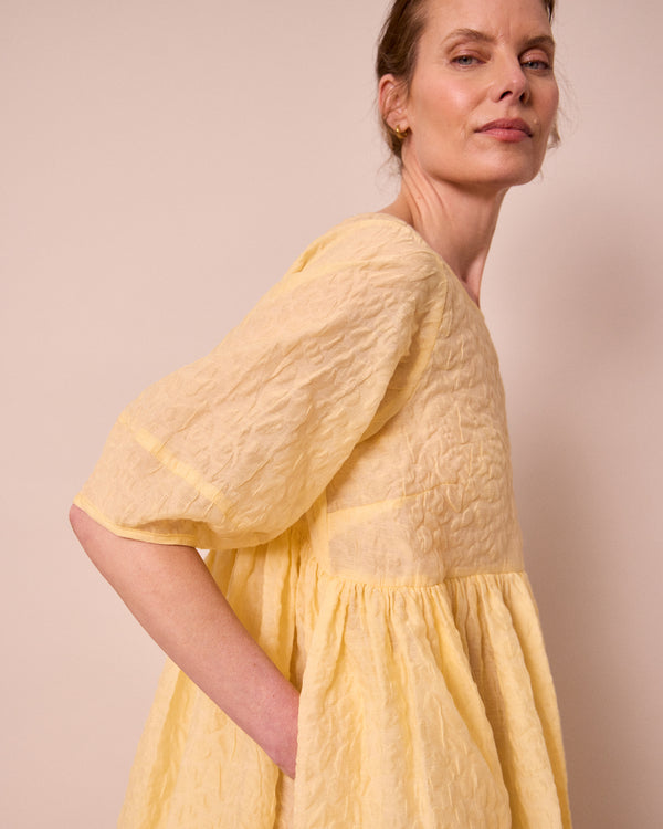 model wears prue butter organza dress