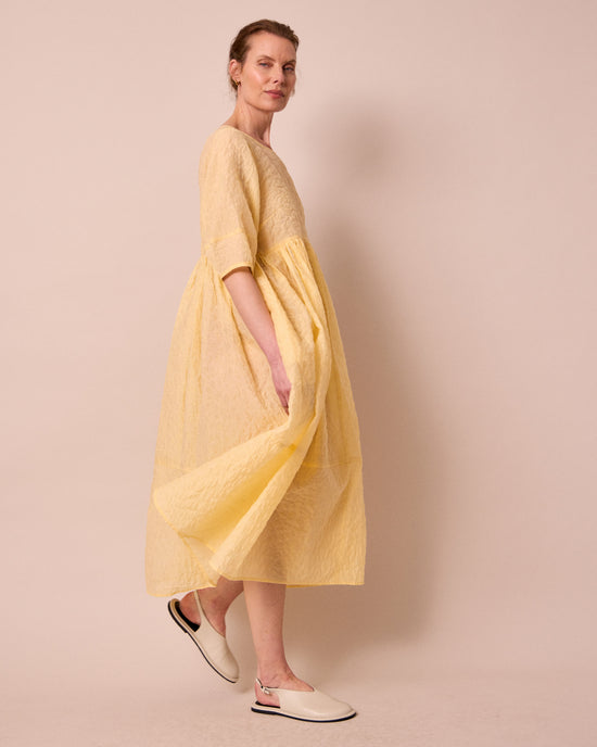 model wears prue butter organza dress