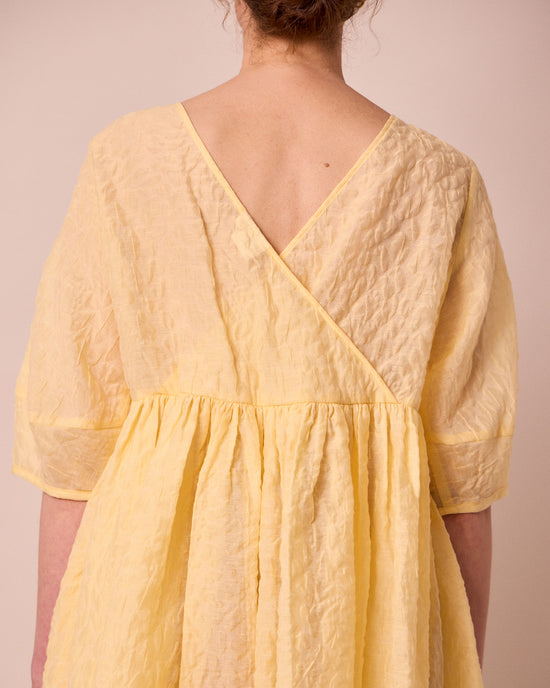 model wears prue butter organza dress