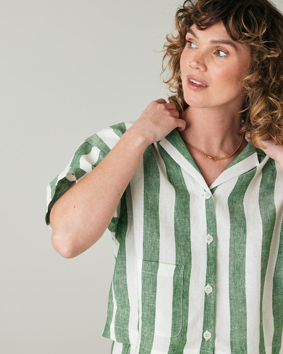 pregnant model wears clover stripe linen ultimate pj top