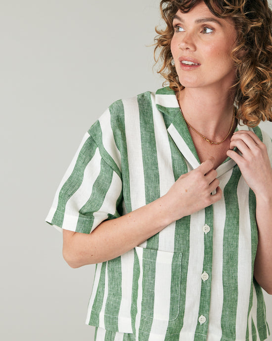 pregnant model wears clover stripe linen ultimate pj top