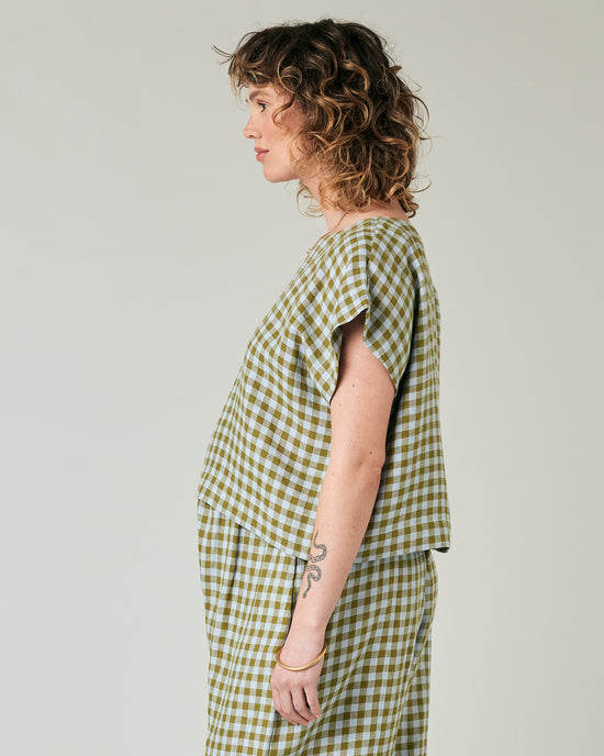 pregnant model wears meadow check linen polly top