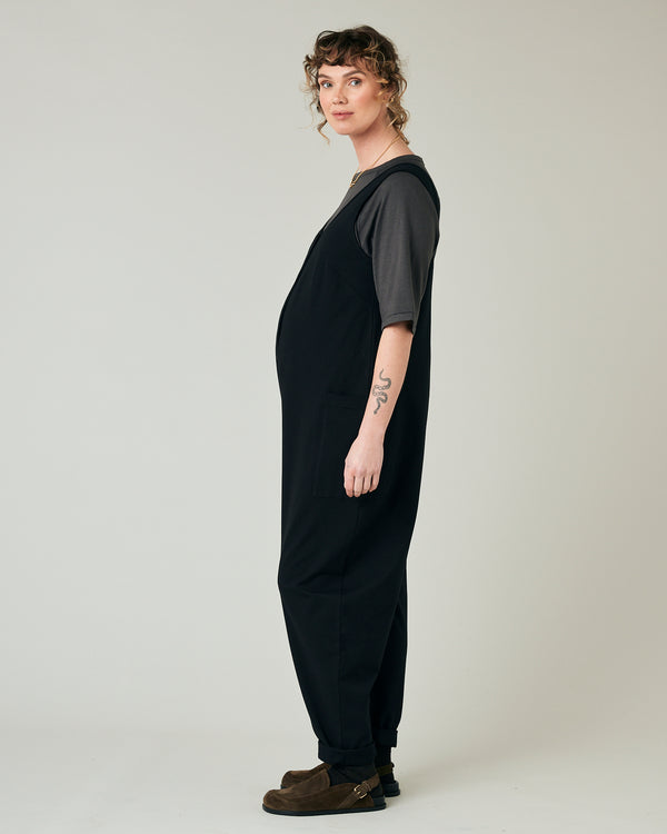 pregnant model wears black poppy jumpsuit