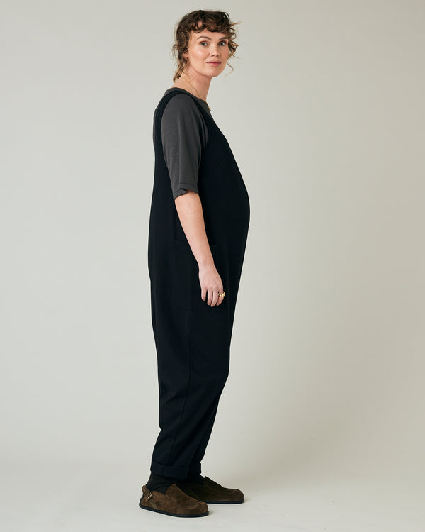 pregnant model wears black poppy jumpsuit