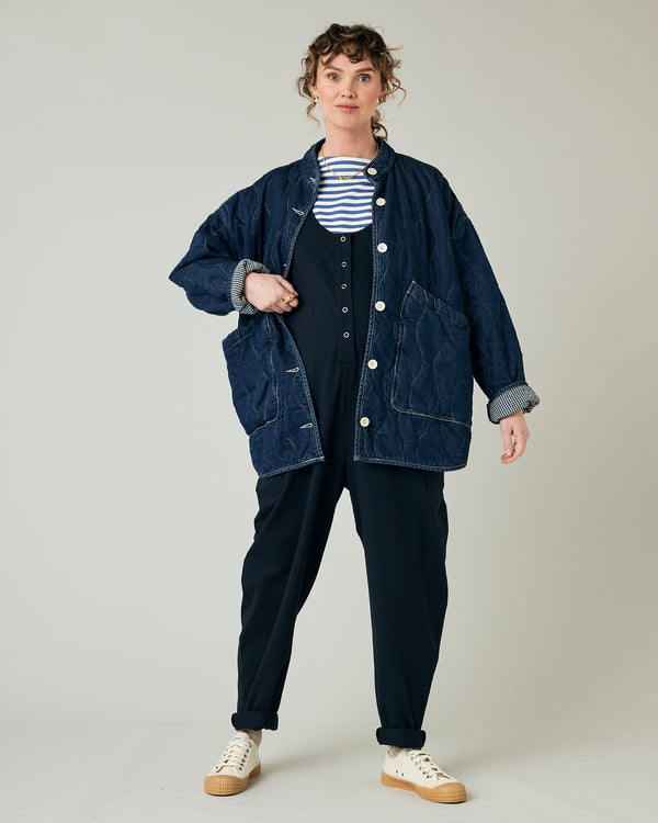 pregnant model wears navy poppy jumpsuit