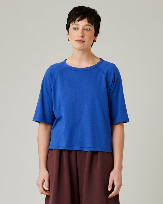 model wears lapis blue raglan