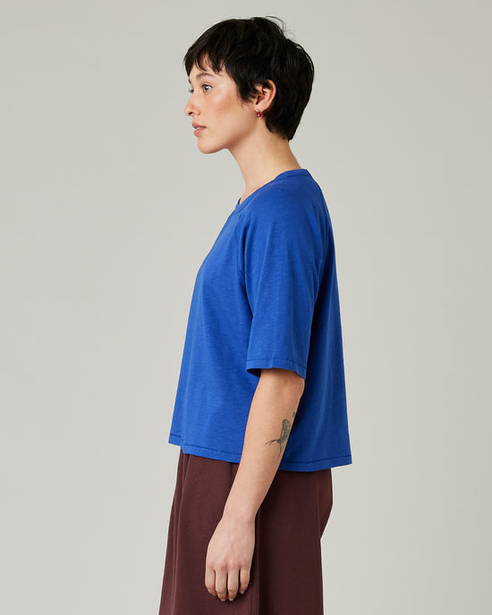 model wears lapis blue raglan