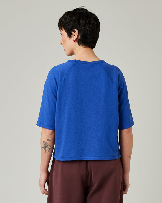 model wears lapis blue raglan