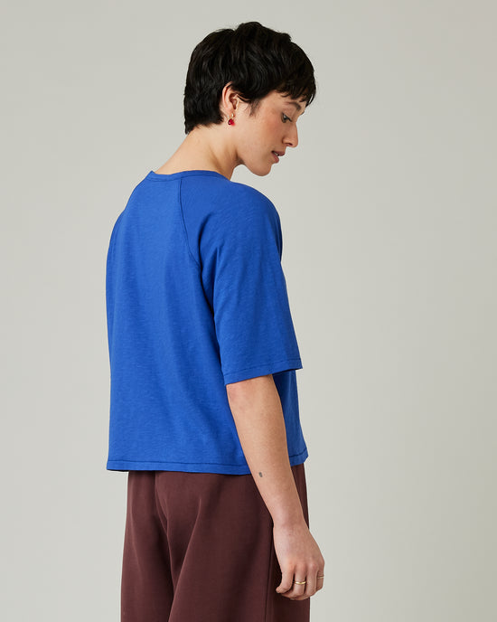 model wears lapis blue raglan