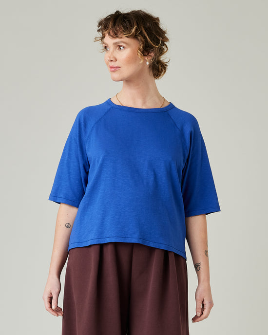 model wears lapis blue raglan