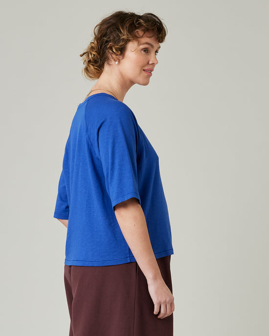 model wears lapis blue raglan