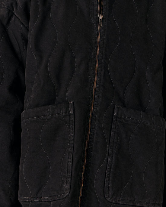 model wears raya black denim jacket