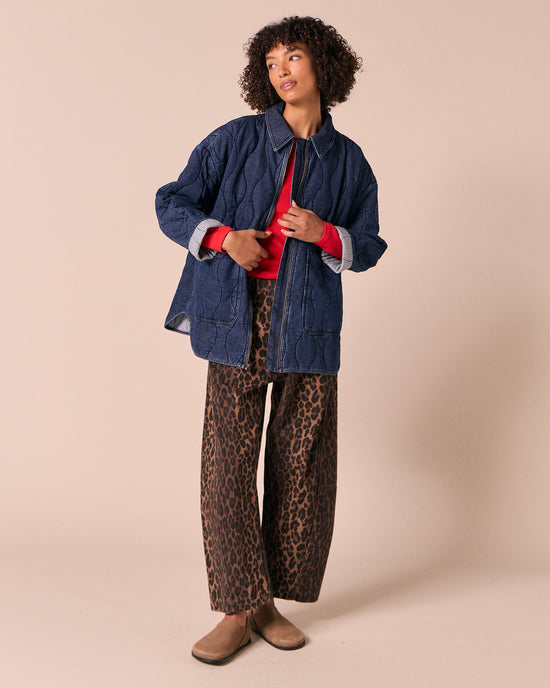 model wears raya mid blue denim jacket