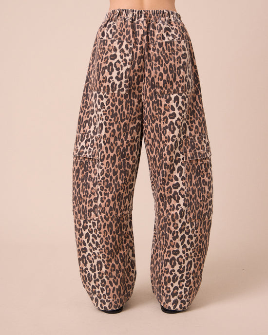 model wears reba leopard print denim jeans back