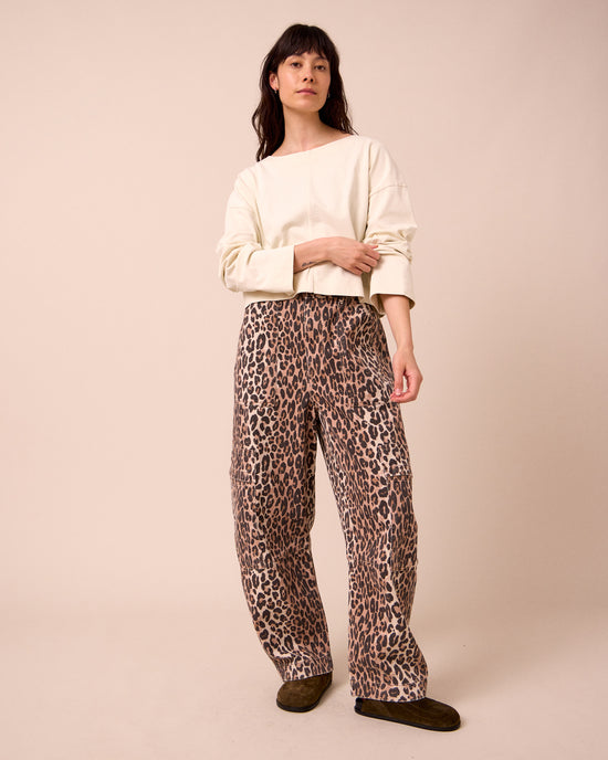 model wears reba leopard print denim jeans right