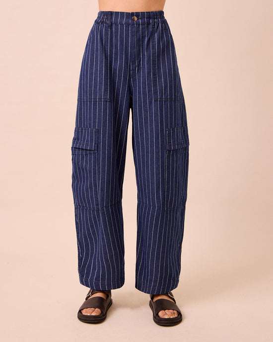 model wears reba mid blue pinstripe denim jeans front