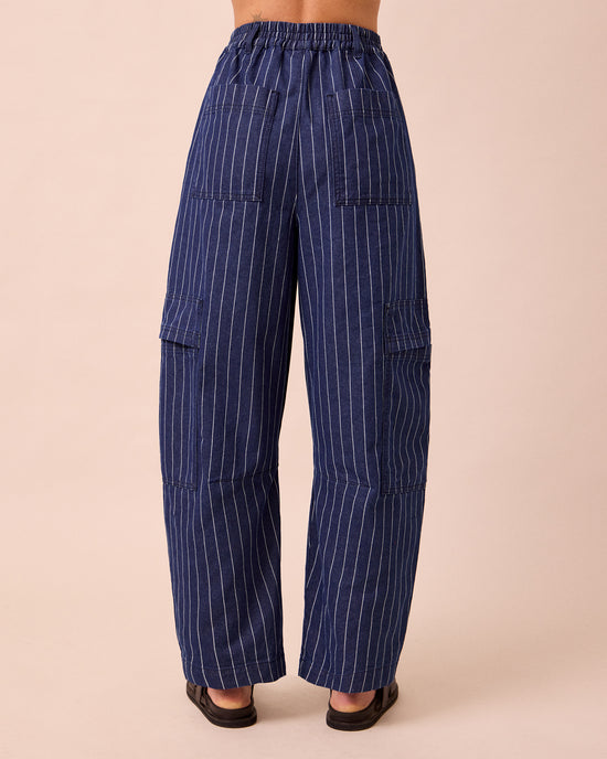 model wears reba mid blue pinstripe denim jeans back
