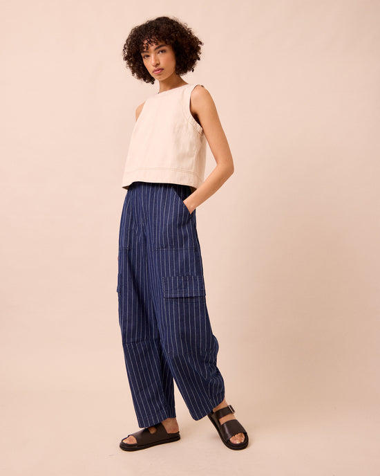 model wears reba mid blue pinstripe denim jeans right