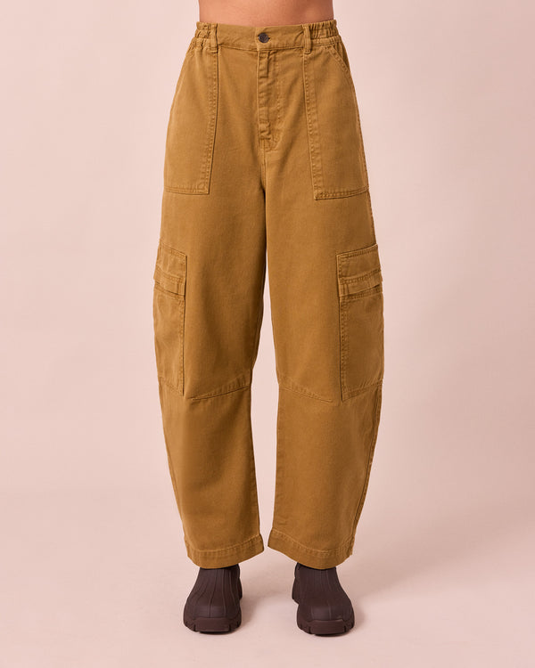 model wears reba nutmeg denim jeans front