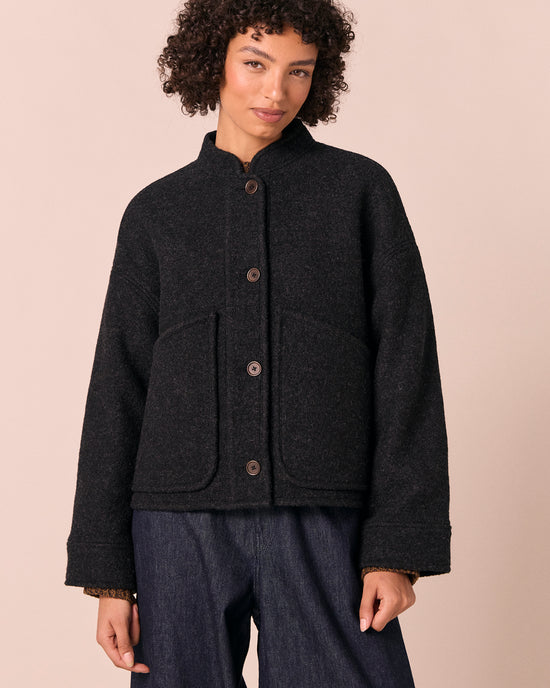 model wears reese black boiled wool jacket