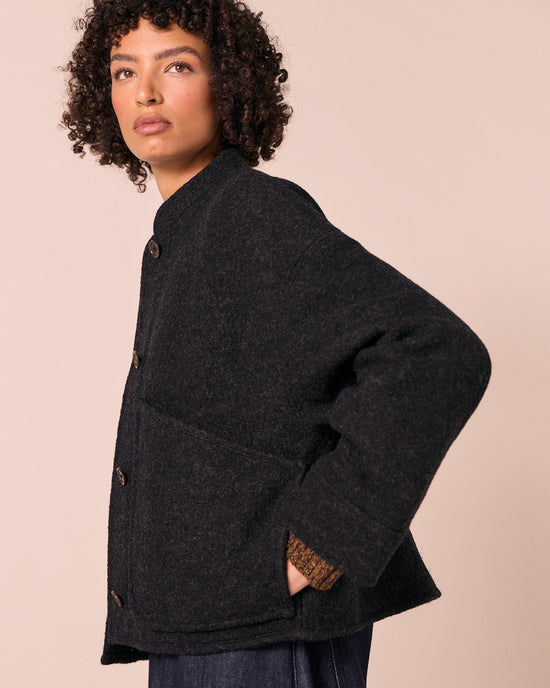 model wears reese black boiled wool jacket