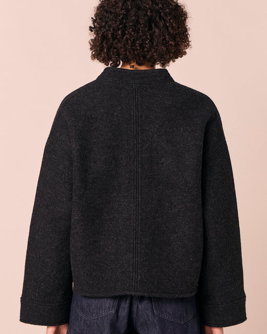 model wears reese black boiled wool jacket