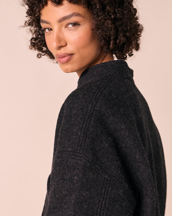 model wears reese black boiled wool jacket