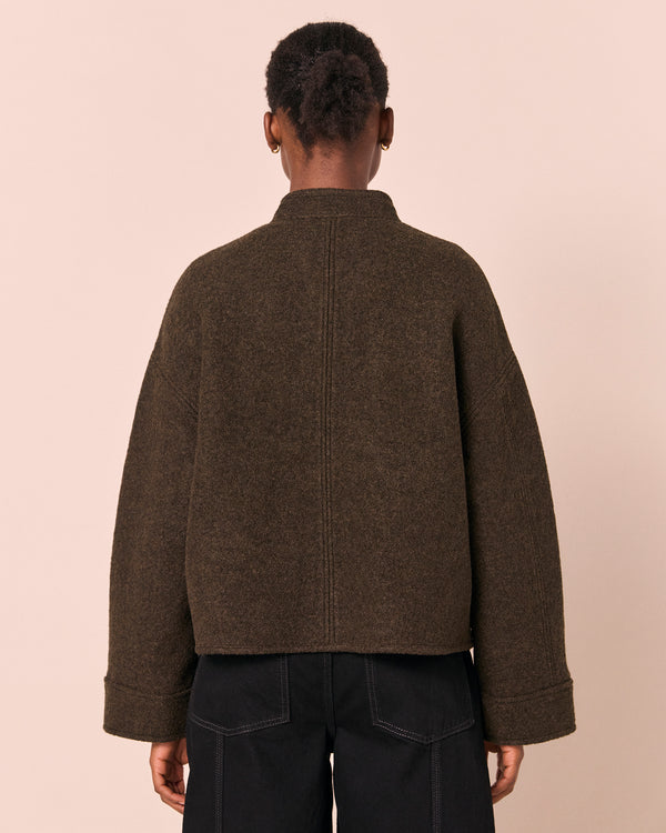 model wears reese dark fern boiled wool jacket