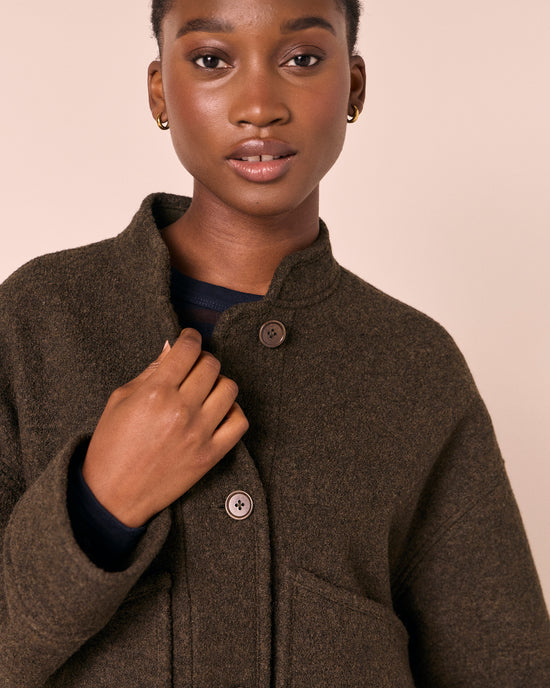 model wears reese dark fern boiled wool jacket