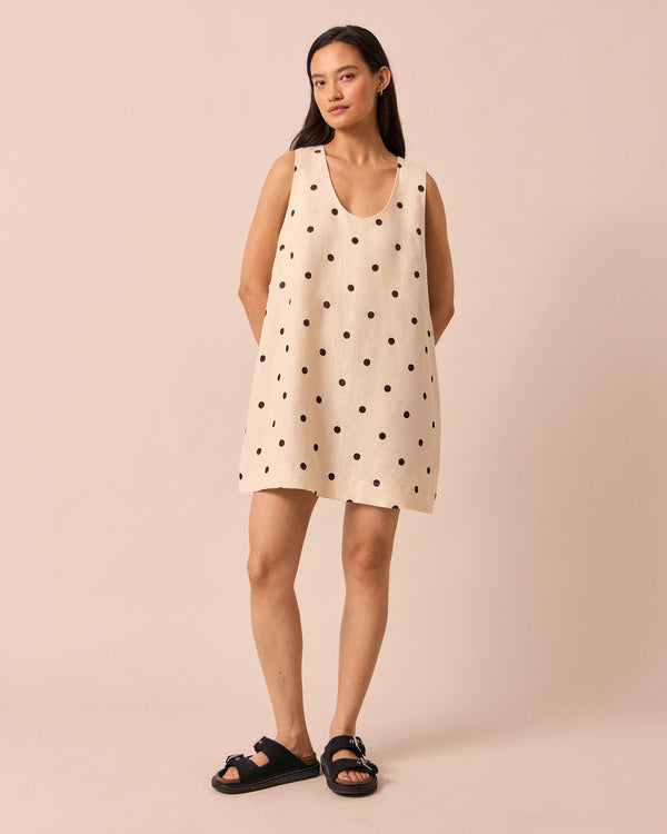 model wears reeta bone spot linen dress