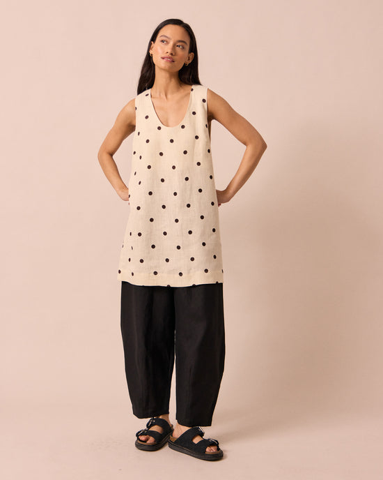 model wears reeta bone spot linen dress