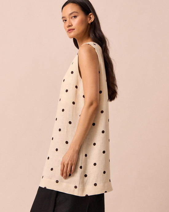 model wears reeta bone spot linen dress