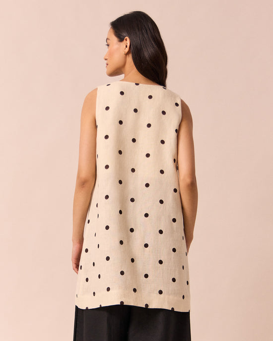 model wears reeta bone spot linen dress
