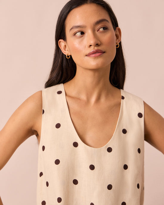 model wears reeta bone spot linen dress