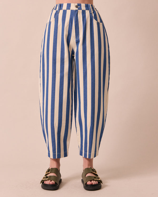 model wears remi ocean stripe denim jeans front