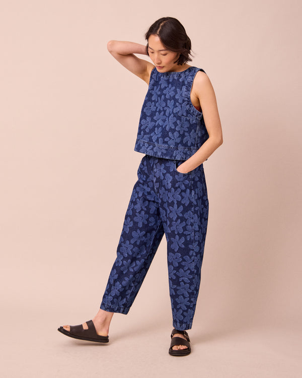 model wears remi pressed flower print denim jeans right