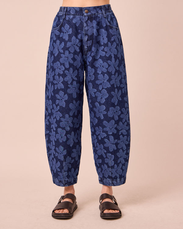 model wears remi pressed flower print denim jeans front