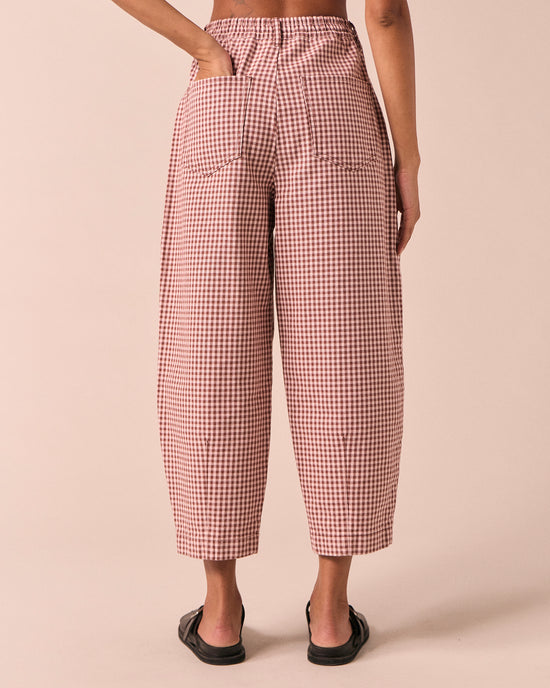 model wears remi taffy mini gingham denim jeans back