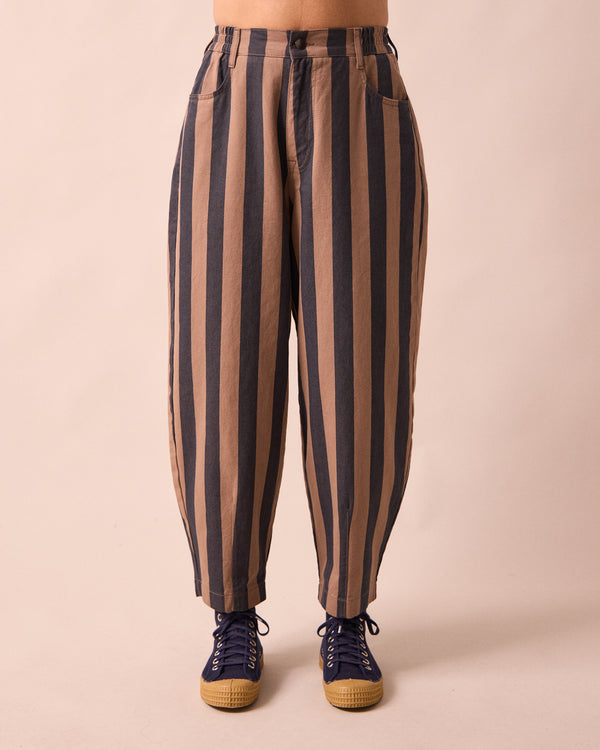 model wears remi graphite and mocha denim jeans front