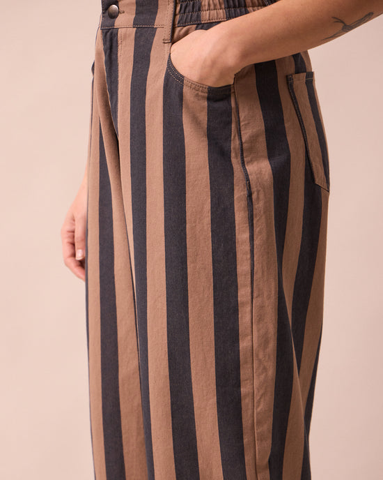 model wears remi graphite and mocha denim jeans detail