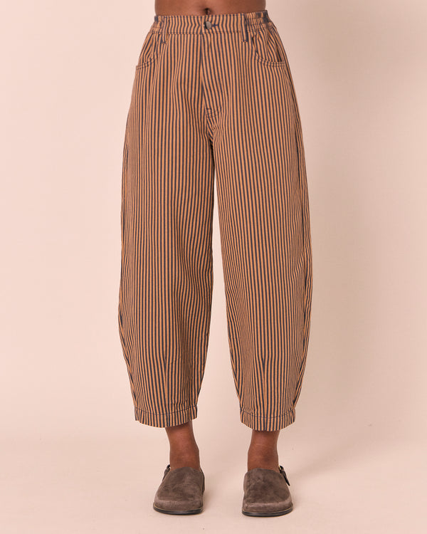 model wears remi nutmeg pinstripe denim jeans front