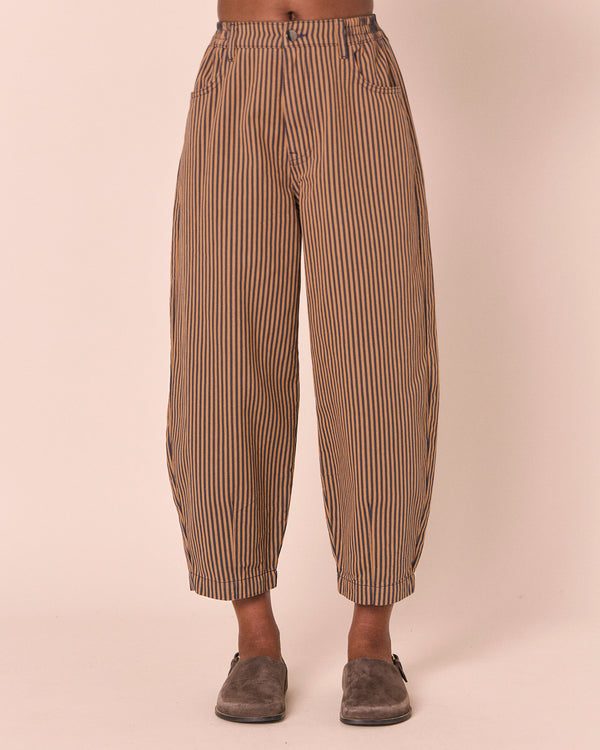 model wears remi nutmeg pinstripe denim jeans front
