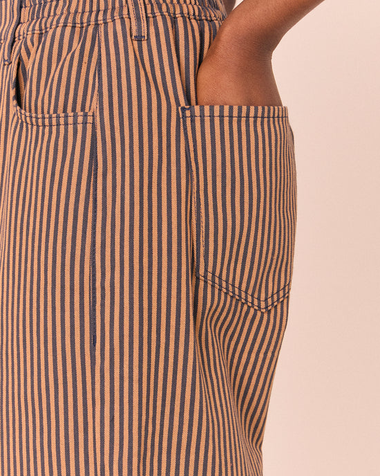 model wears remi nutmeg pinstripe denim jeans