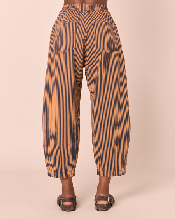 model wears remi nutmeg pinstripe denim jeans back