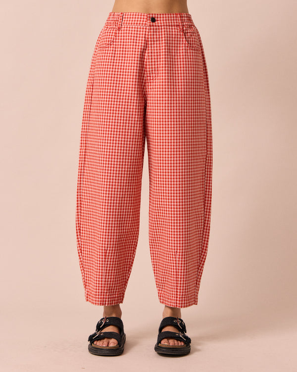 model wears remi poppy red gingham jeans
